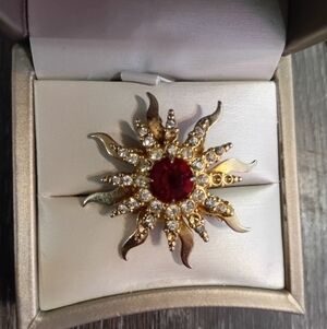 Elegant Gold and Red Sunburst Brooch
